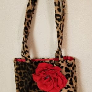 Faux leopard skin handbag